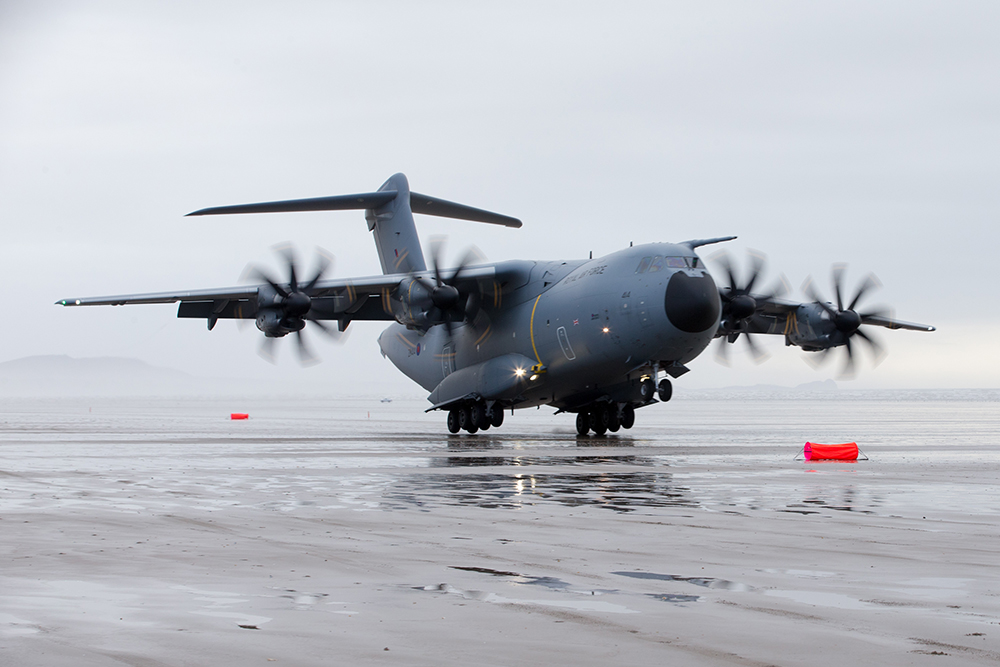 Photo: Atlas is able to operate from short un-prepared, as well as semi-prepared, strips, day and night. Image shows an atlas touching down on a temporary sandy beach.
